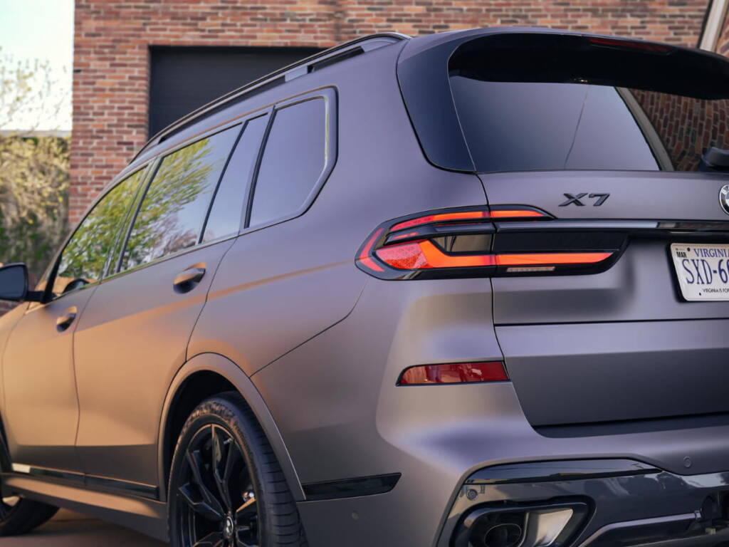 Matte gray BMW X7 parked outside Exodius Auto Protection.