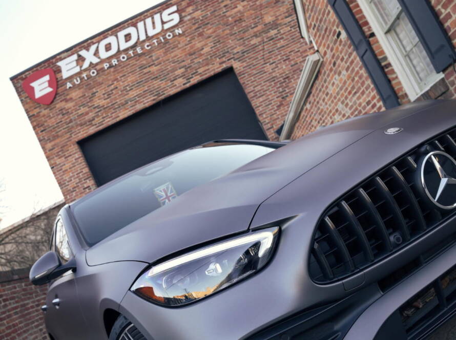Matte gray Mercedes-AMG parked outside Exodius Auto Protection in Alexandria.