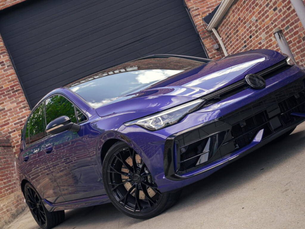 Purple Volkswagen Golf R parked outside Exodius Auto Protection.